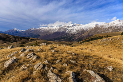 Scenic view of snowcapped mountains against sky