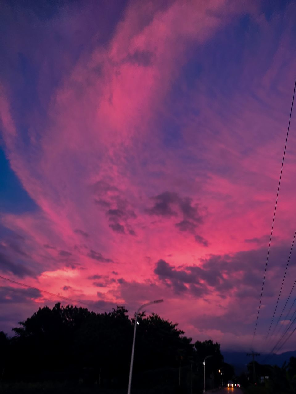 sky, cloud, afterglow, sunset, dusk, evening, nature, red sky at morning, beauty in nature, dramatic sky, electricity, no people, silhouette, cable, tree, outdoors, scenics - nature, horizon, architecture, plant, tranquility, tranquil scene, transportation, power line, environment, technology, electricity pylon