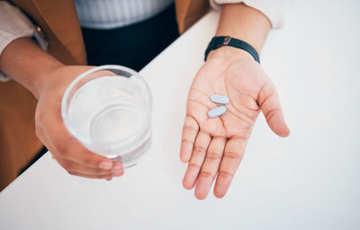 Cropped hand of doctor examining patient