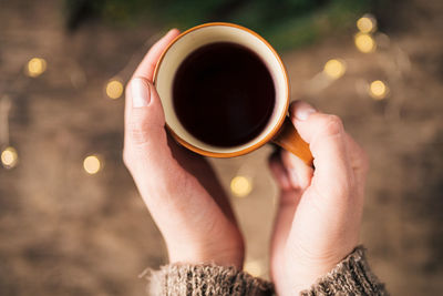 Close-up of woman holding coffee cup