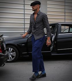 Full length of man standing on car