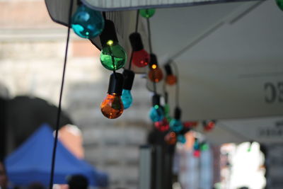 Low angle view of light bulbs hanging