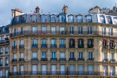 Typical architectural features of parisian buildings. stone facade with blu zinc plates roof
