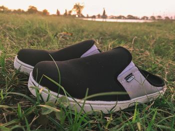 Close-up of shoes on field