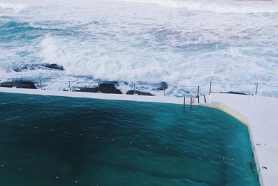 High angle view of infinity pool by sea