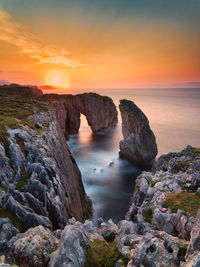 Scenic view of sea against sky during sunset