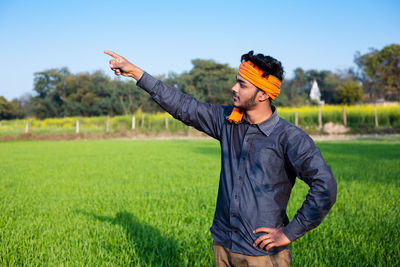 Full length of man standing on field