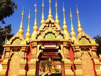 Low angle view of statue against temple