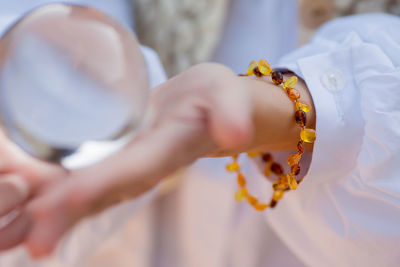 Close-up of couple holding hands