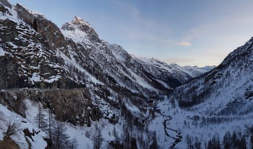 Scenic view of snowcapped mountains against sky