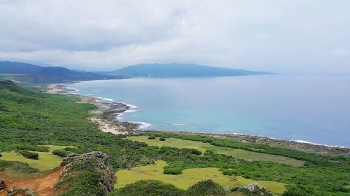 Scenic view of sea against cloudy sky