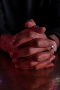Close-up of hand holding leaf