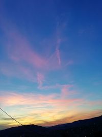 Low angle view of cloudy sky during sunset