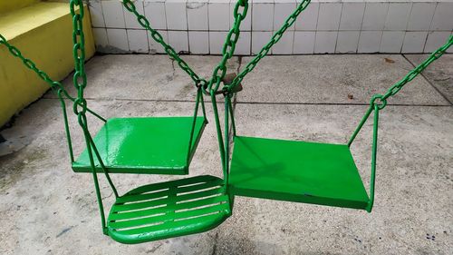 High angle view of green plants on tiled floor against wall