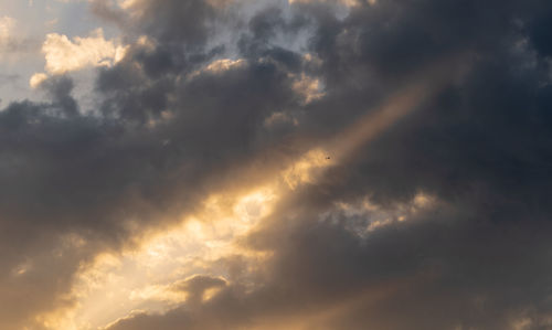 Low angle view of dramatic sky during sunset