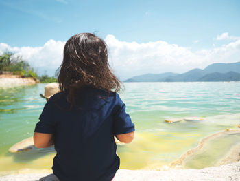 Rear view of girl by hot spring at hierve el agua