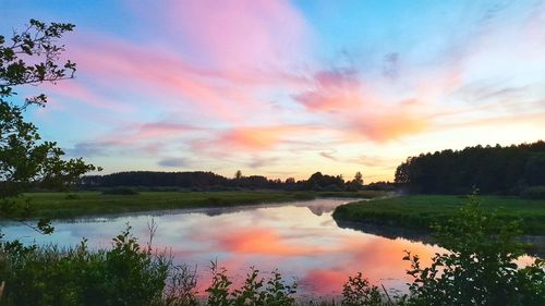 Scenic view of lake against sky during sunset