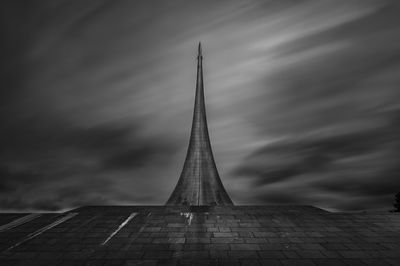 Low angle view of building against cloudy sky
