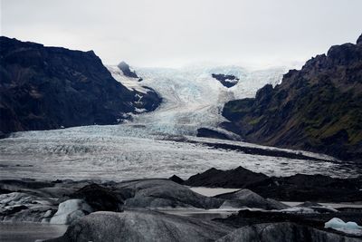 Scenic view of snow capped mountain against sky