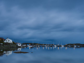 Cloudy sky over marina at dusk