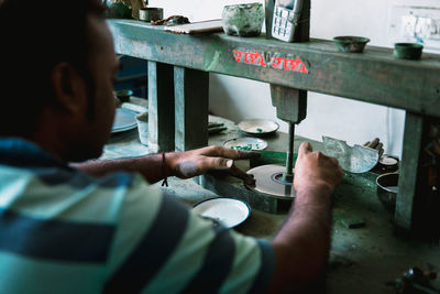 Portrait of man working on table