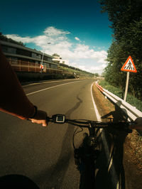 Man riding bicycle on road