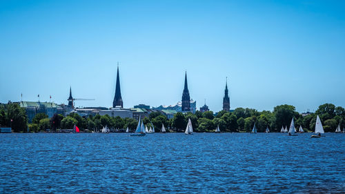 Sailboats in a building against blue sky