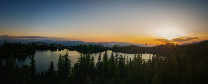 Scenic view of lake against sky during sunset