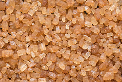 Close up of natural brown sugar texture. brown sugar background. raw sugar. top view. macro