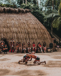Group of people relaxing on beach
