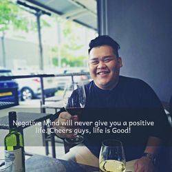 Portrait of a smiling young man with drink