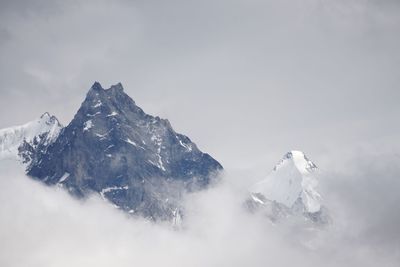 Snowcapped mountain peak against sky