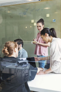 Team of business people having discussion in conference room