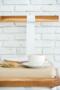 Close-up of coffee cup on table