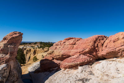 Landscape of white, pink and yellow rock formations at el morro national monument in new mexico