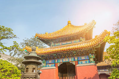 Low angle view of temple against building