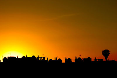 Silhouette of villa with arabic architecture in the sunset against the light