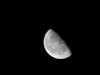 Low angle view of moon against sky at night