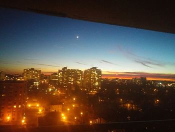 Illuminated cityscape at night