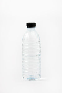 Close-up of glass bottle against white background
