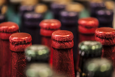 Close-up of beer bottles arranged