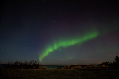 Scenic view of landscape against sky at night