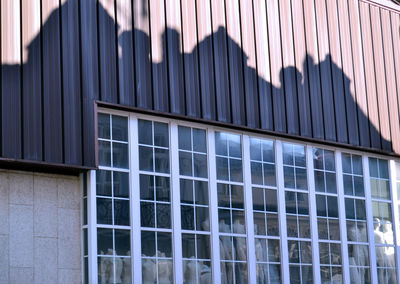 Close-up of office building against sky