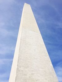 Low angle view of tower against cloudy sky