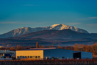 Industry bulding destroys the view to the snow mountain,