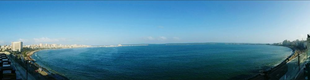 Scenic view of sea against blue sky