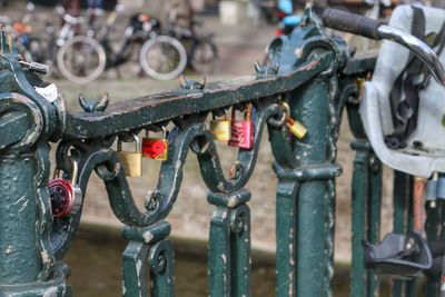 Close-up of love locks on railing