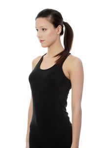 Young woman standing against white background