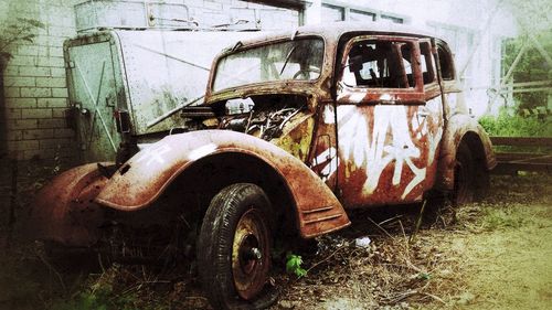 Abandoned car on field