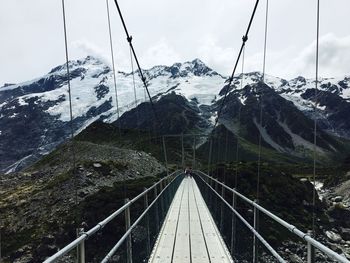 Close-up of bridge over water against sky